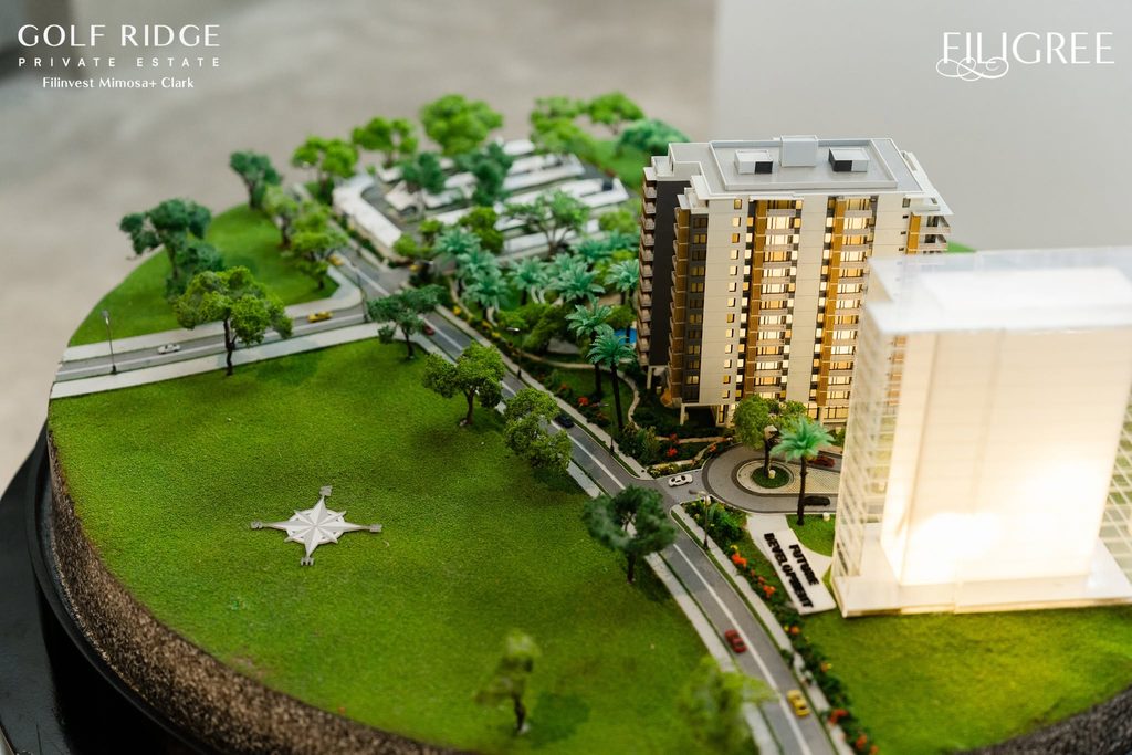 Scale model of Golf Ridge Private Estate featuring its condominium buildings, landscaped grounds, roads, and surrounding amenities.